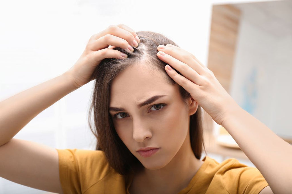 A woman with thinning hair.