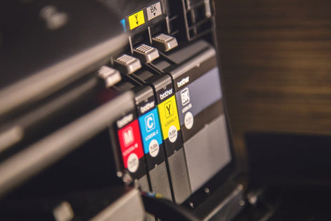 image of a printer with it's sustainable refillable ink cartridges exposed