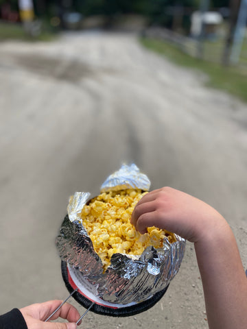 eating jiffy pop popcorn on our camping trip