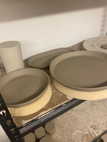 clay plates drying on their molds greenware stage