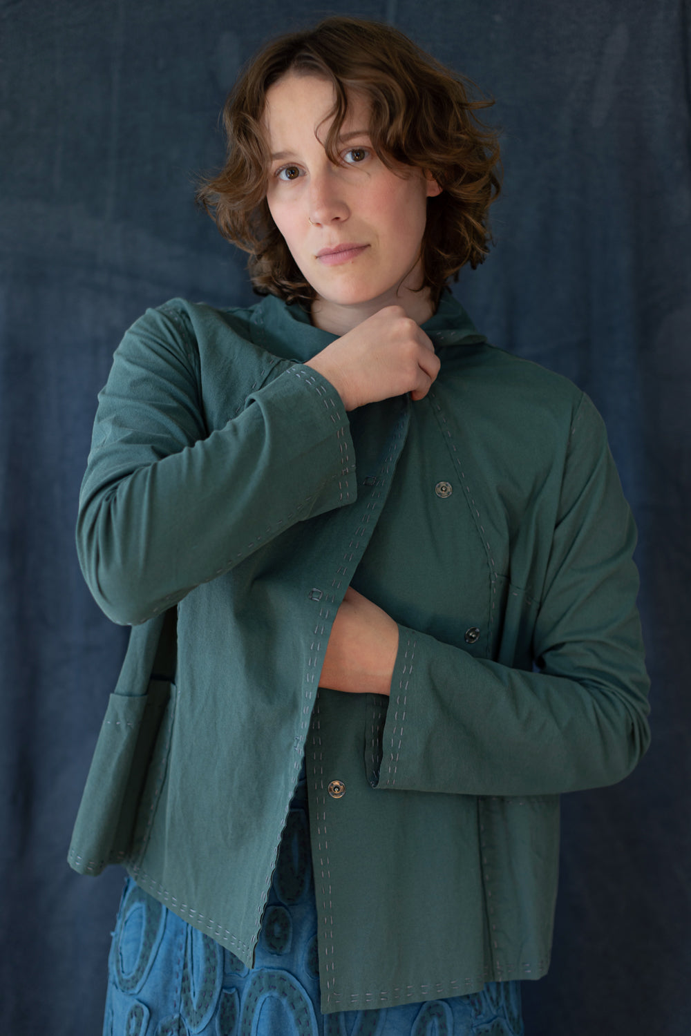 Model shown snapping the Carlson Jacket front.