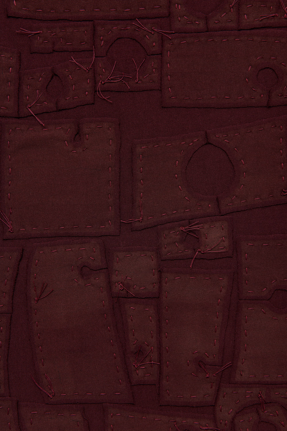 Detail of the Abstract Suns design in plum negative reverse appliqué.