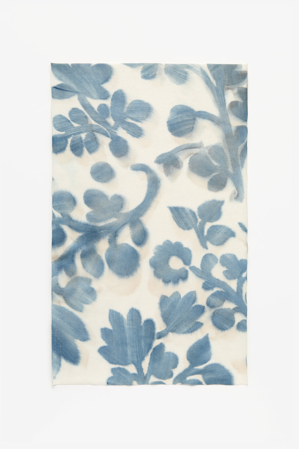 Swatch featuring indigo flowers hand-painted onto natural color fabric.