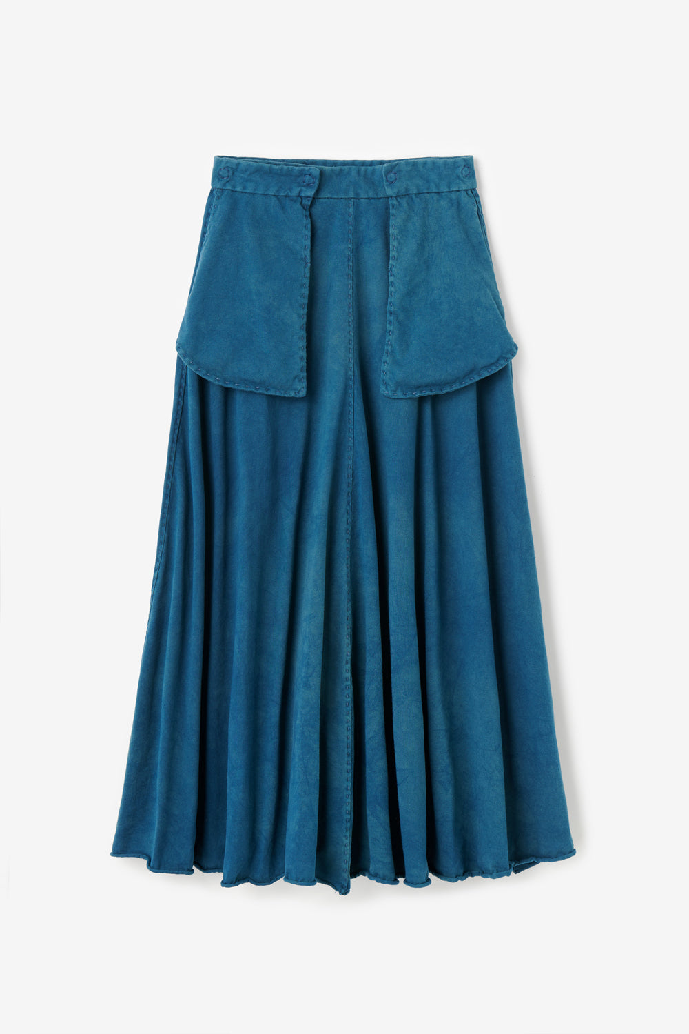 The Elle Skirt in hand-sewn organic cotton with outside pockets. Shown in hand-dyed indigo color.