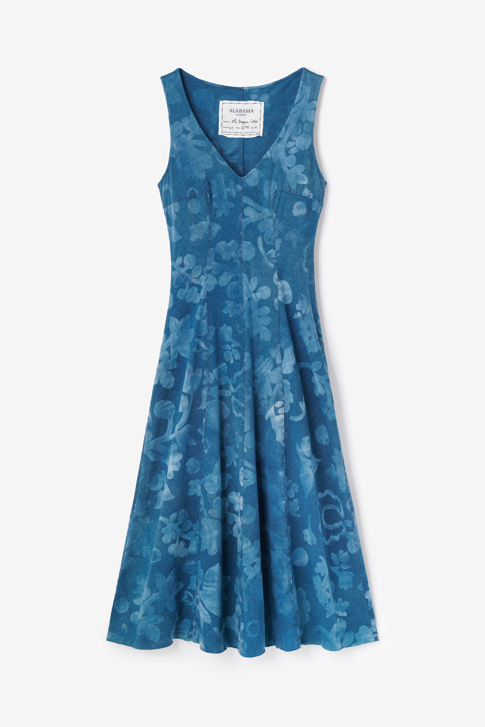 Alabama Chanin Niko Dress featuring hand-sewn seams and painted floral motif. Shown in Indigo color with white flowers.