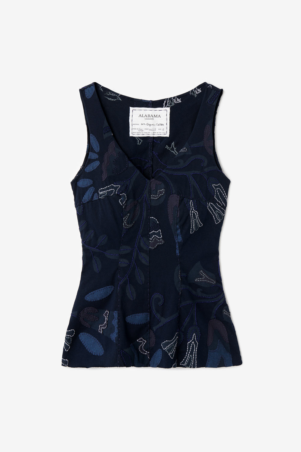The Alex Top in hand-sewn organic cotton with floral appliqué. Shown in navy blue colorway.