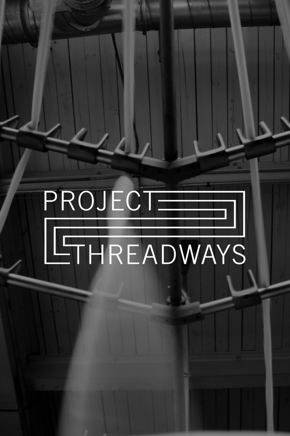 Image of cotton being spun into yarn with Project Threadways logo.