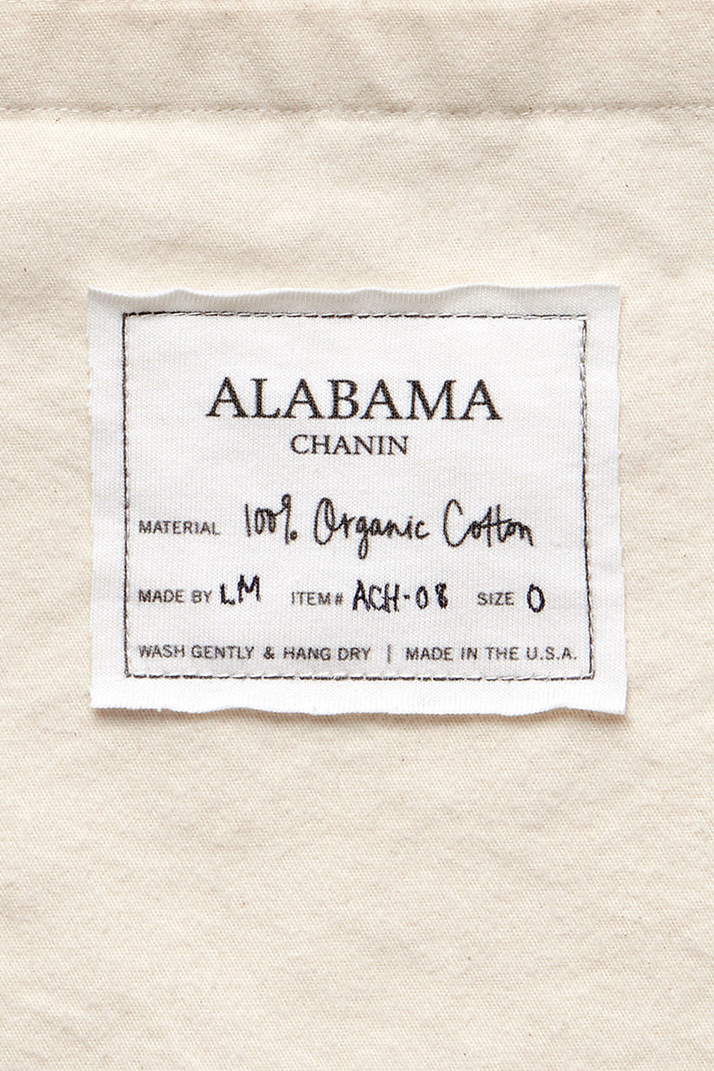 Close-up view of Alabama Chanin label on the Flannel Tote Bag.