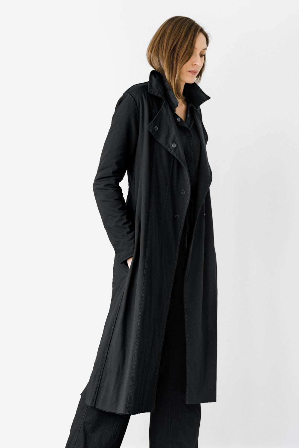 The School of Making Asymmetrical Trench in Black. Styled on Model.