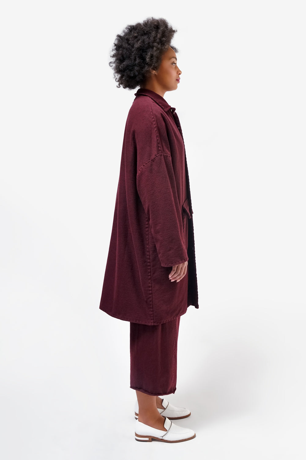 The School of Making model wearing the  Car Coat in plum. Made with 100% organic cotton.