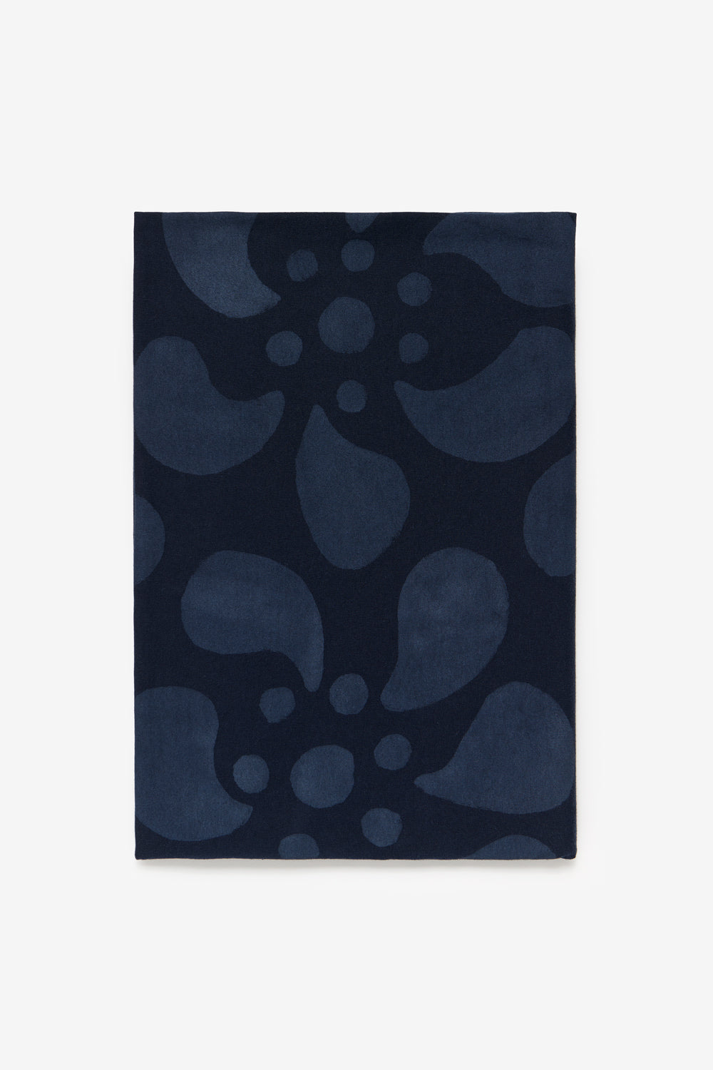 The Bellis stencil shown painted on navy fabric.