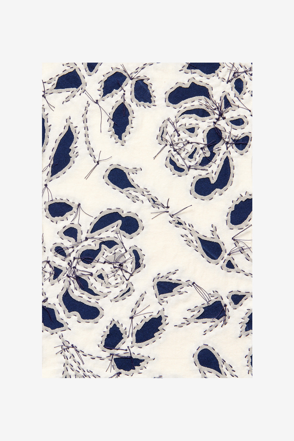 Swatch featuring the rose stencil and reverse appliqué in natural and navy.