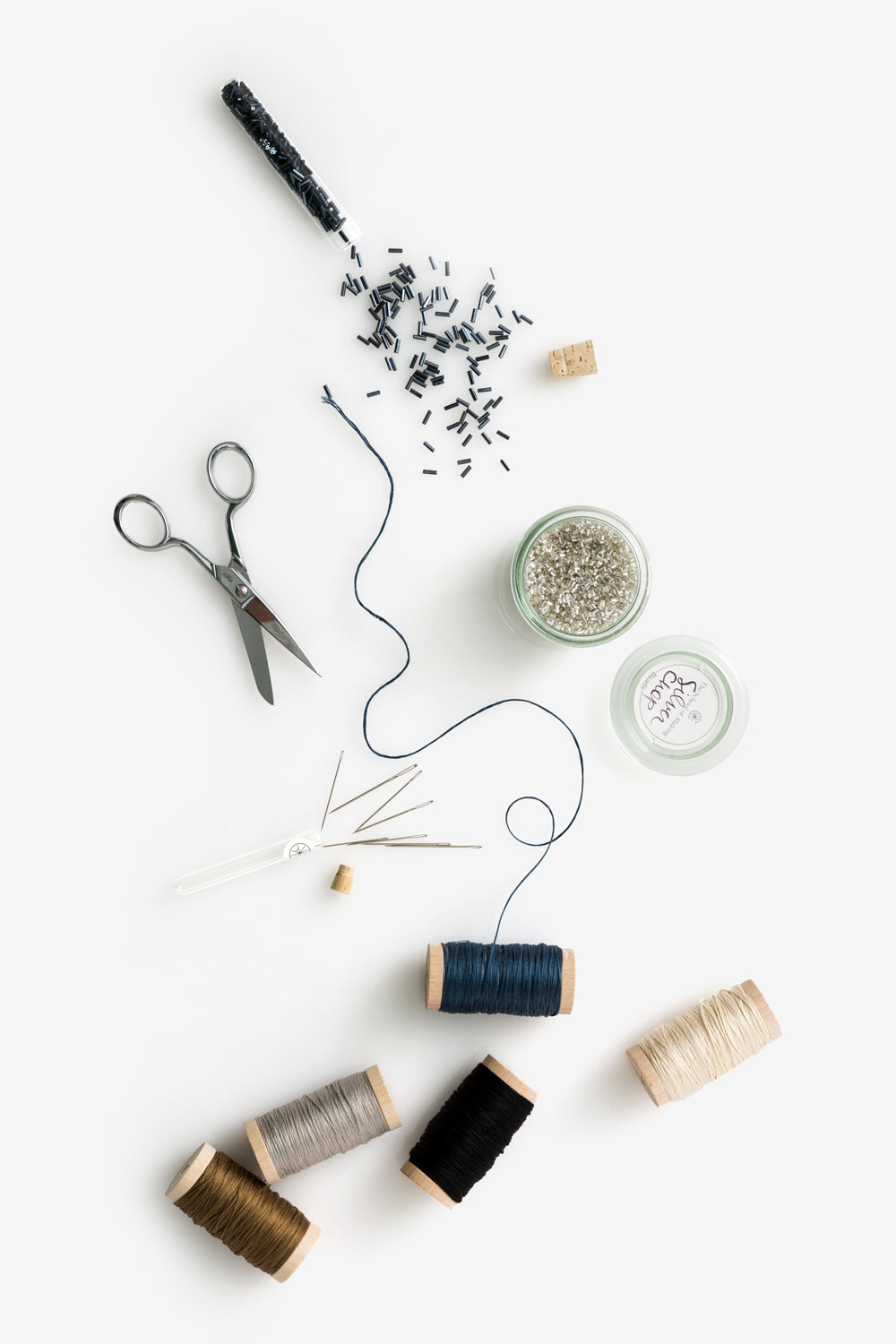 The School of Making Notions, bead, embroidery floss, and needles.