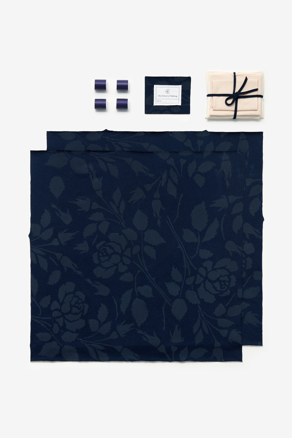 The Square Top DIY Kit in Navy with Rose stencil, shown with thread and pre-cut fabric.