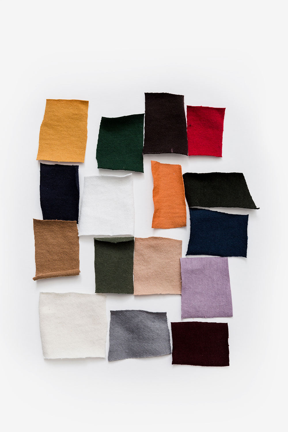 Pieces of organic cotton fabric scraps in assorted colors.