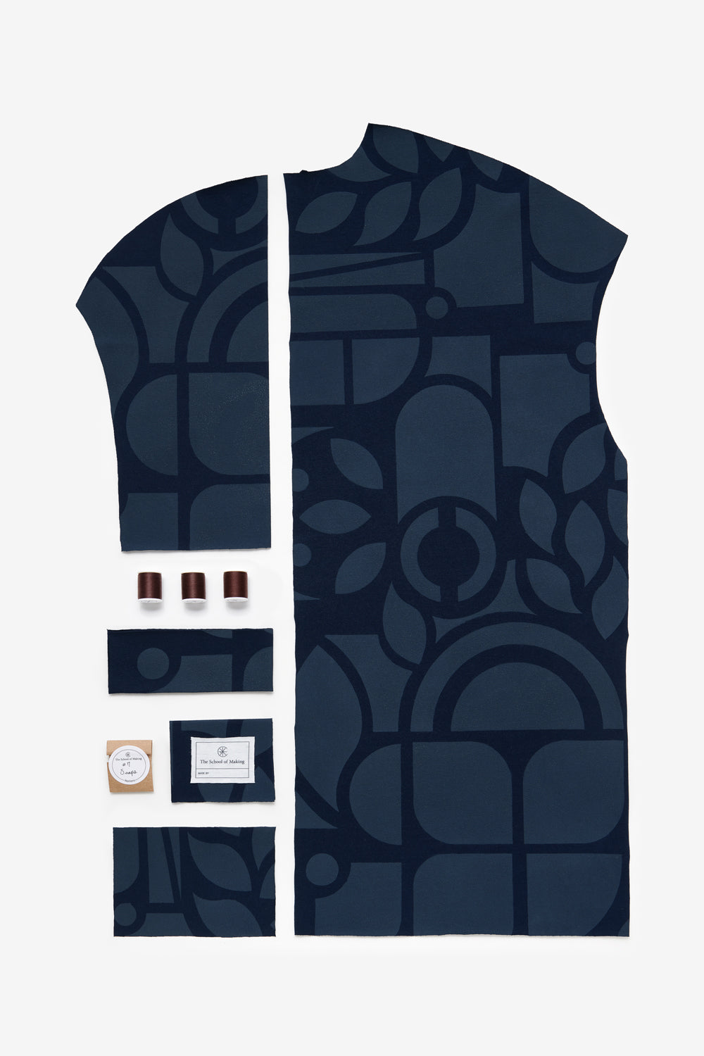 The School of Making DIY kit contents of the Car Coat in navy with Abstract design. Features pre-cut fabric and notions.
