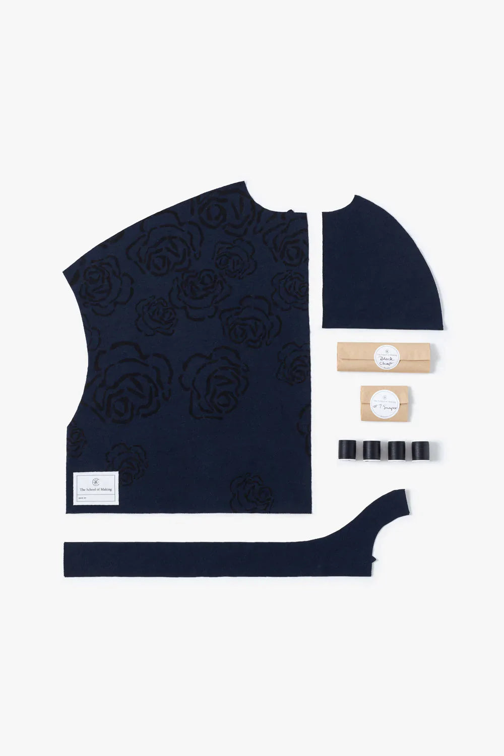 Contents of The School of Making Kristina’s Rose Cropped Car Jacket DIY Kit in Black and Navy.