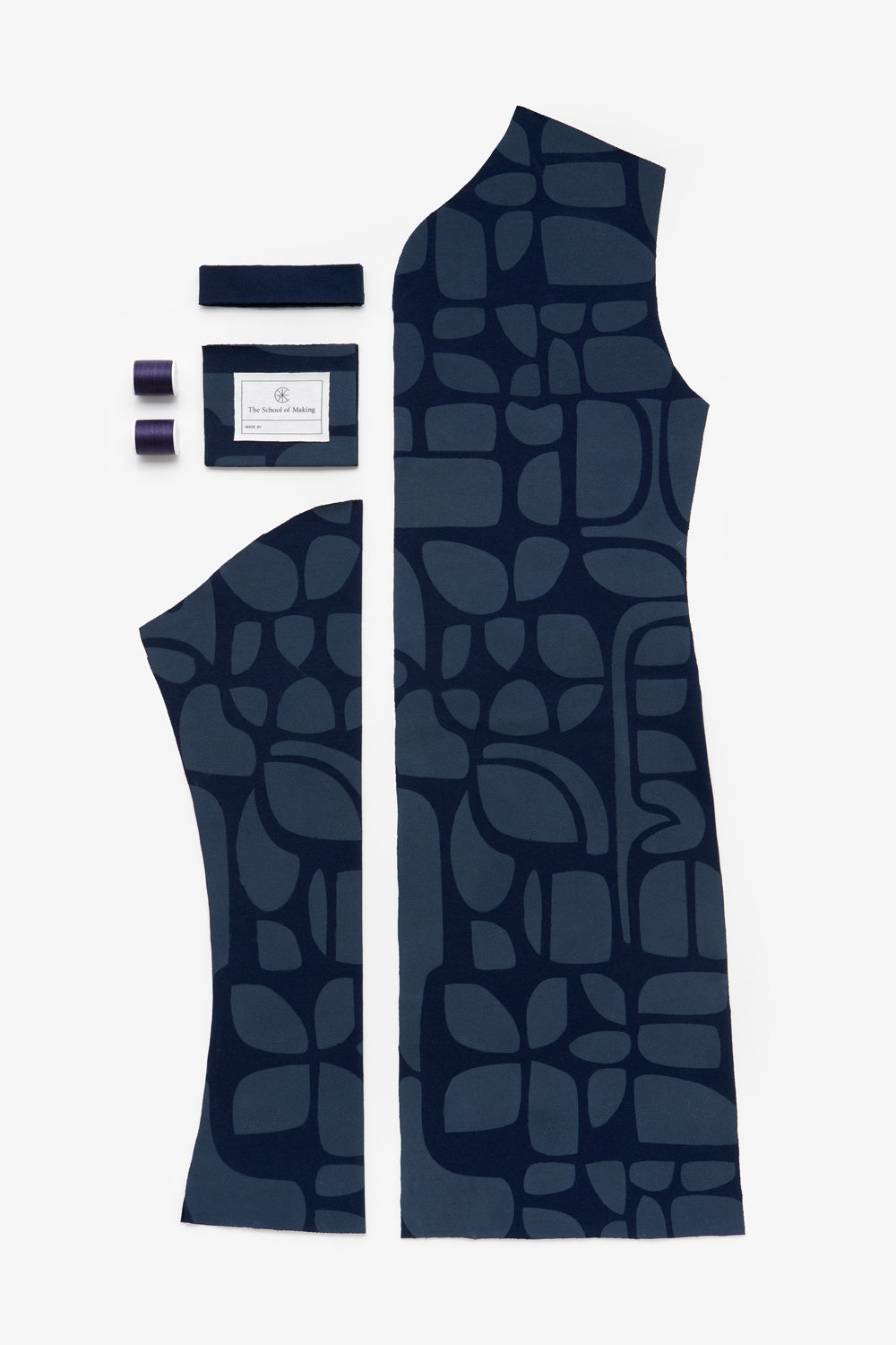 The School of Making DIY kit contents of the Classic Coat in navy with Tony design. Features pre-cut fabric and notions.