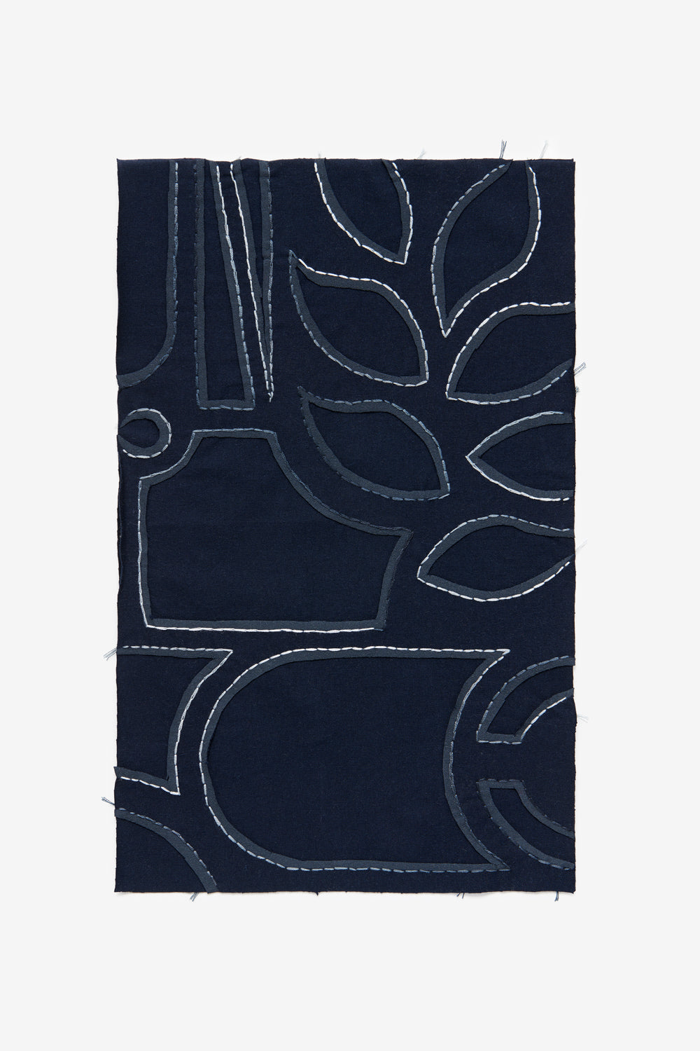 The School of Making fabric swatch in navy and multi colored floss with Abstract design.