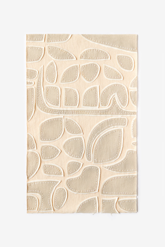 The School of Making fabric swatch in natural and beige with Tony stencil design.