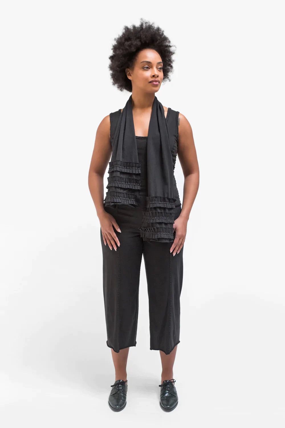 The School of Making model in Crop Pant in black made with 100% organic cotton. 