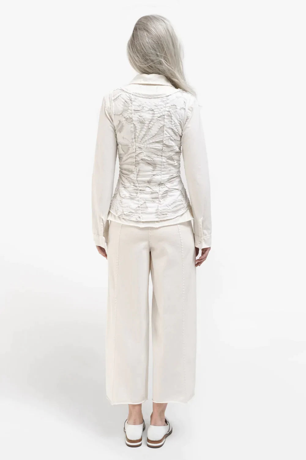 The School of Making model in Crop Pants and Corset in white made with 100% organic cotton. 