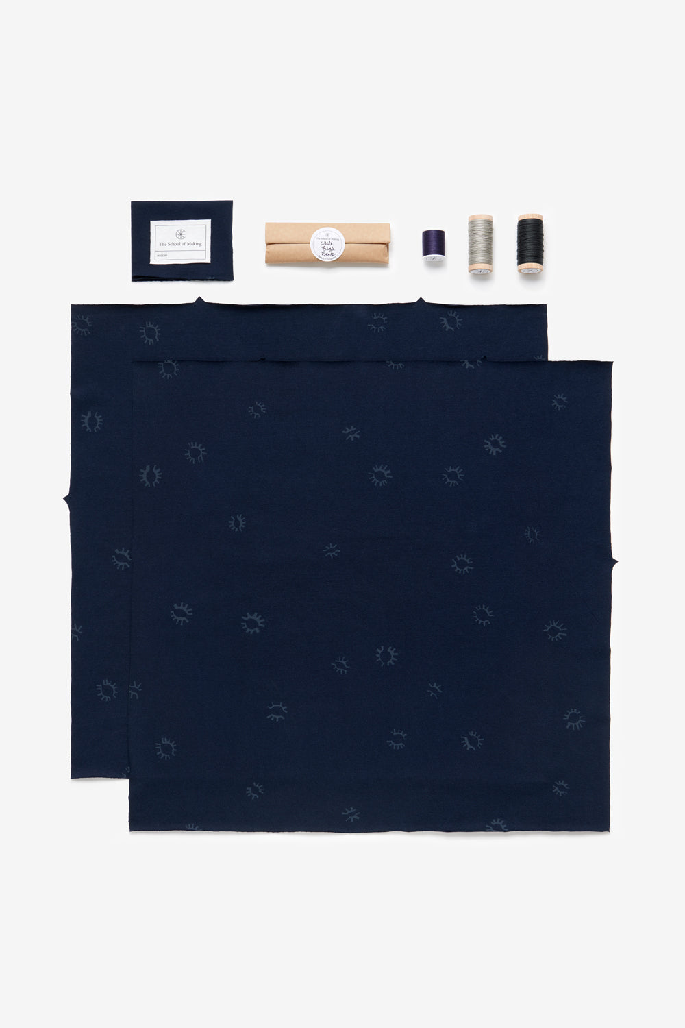 The School of Making DIY kit contents of the Square Top in navy, with Eyelet design. Features pre-cut fabric and notions.