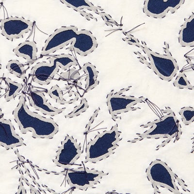 Reverse appliqué fabric swatch in Natural on Navy