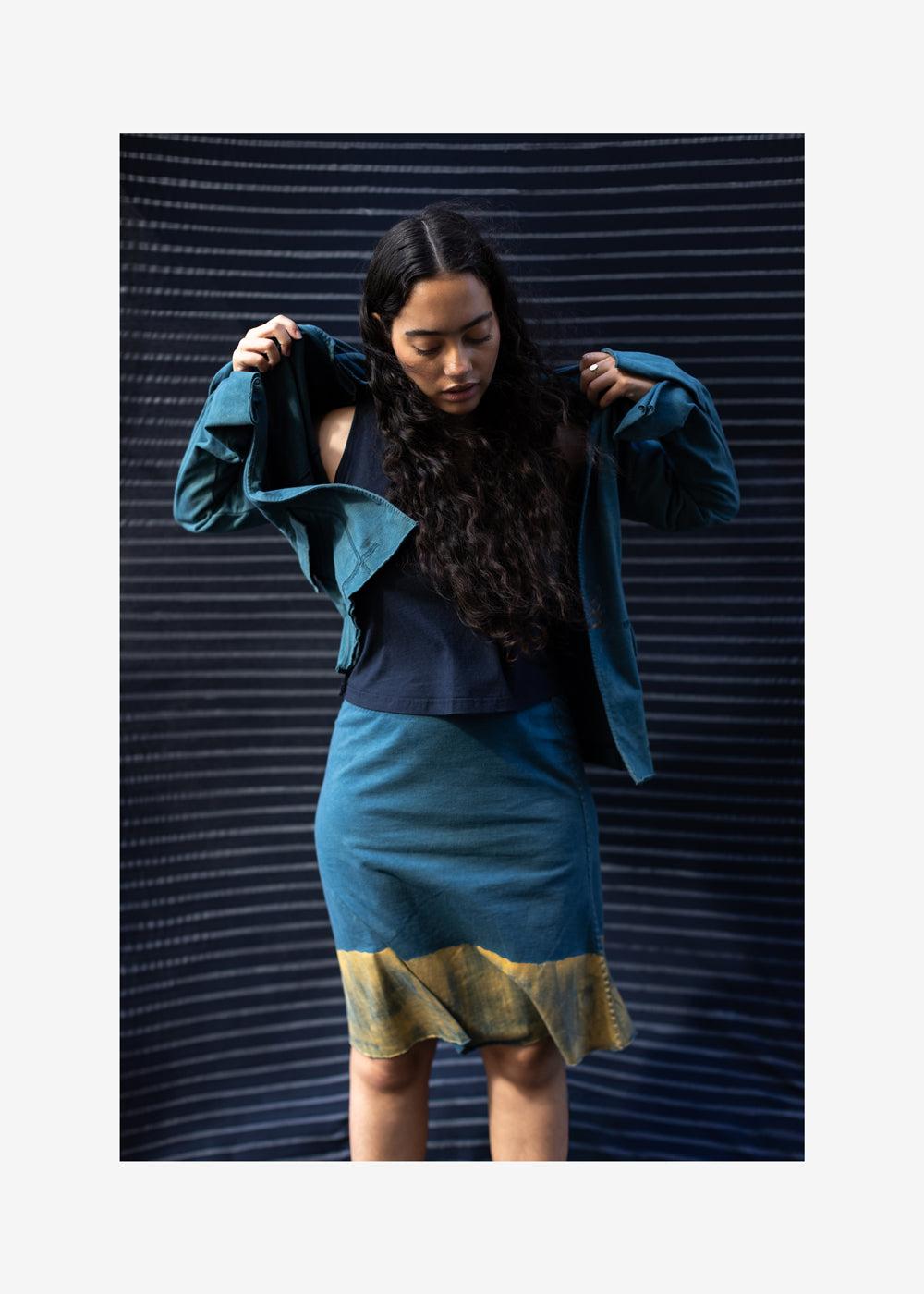 Model wearing Indigo Ridley Jacket and Coda Skirt.