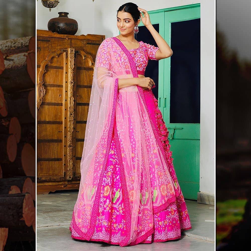 Embroidered stories on her pink lehenga 