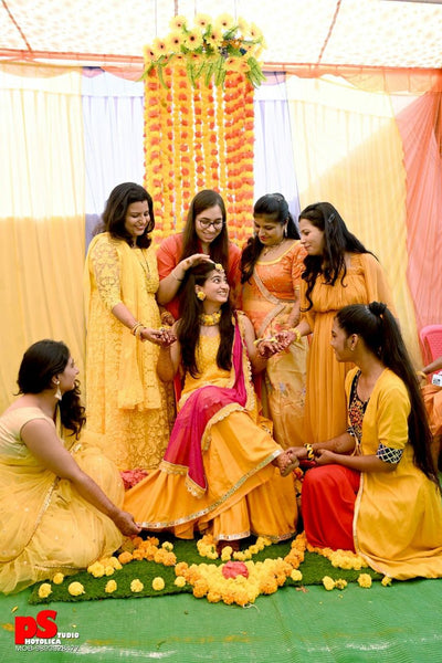 Photo of Bride with bridesmaids on haldi