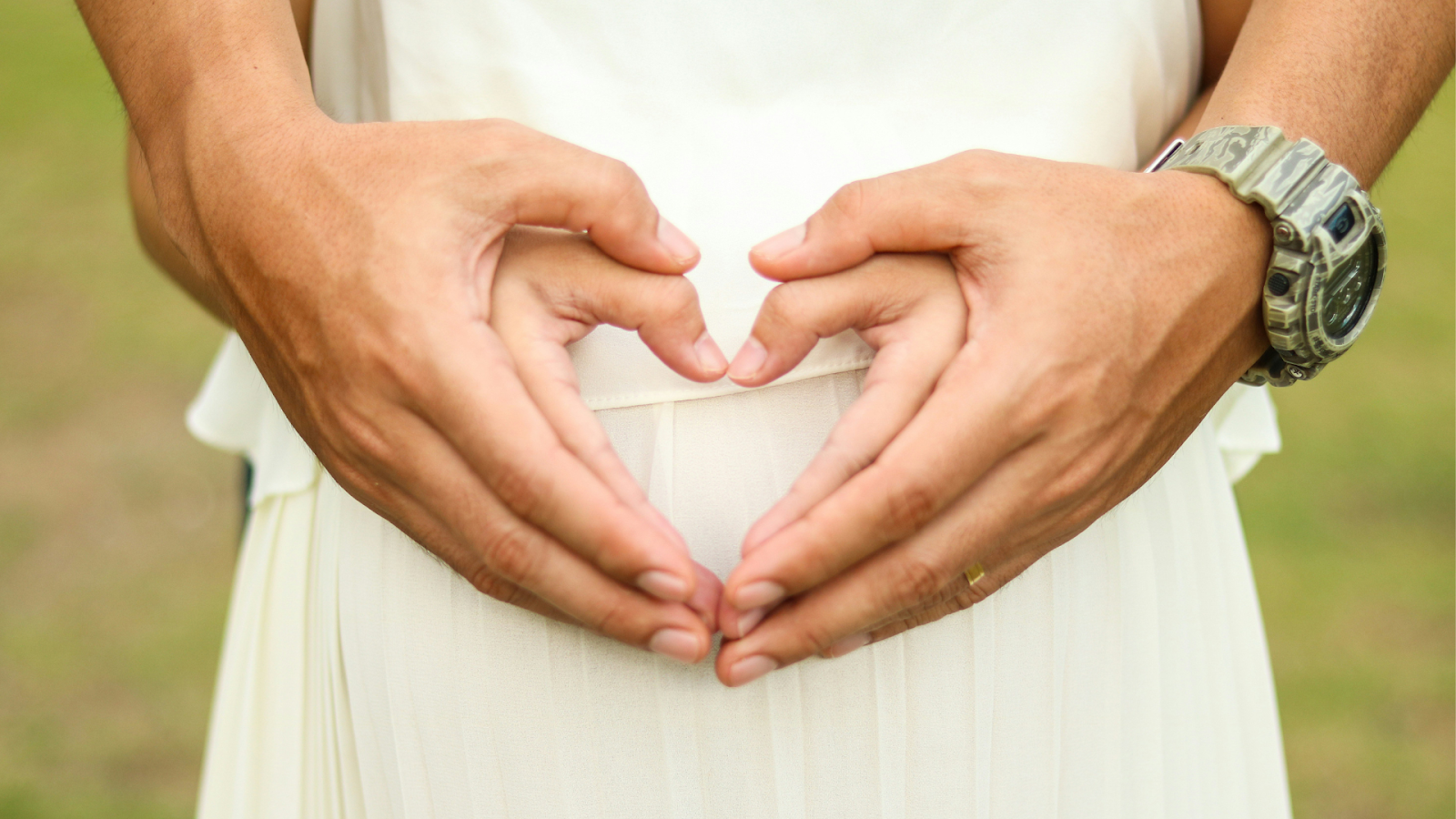 People With Heart Hands Over Belly