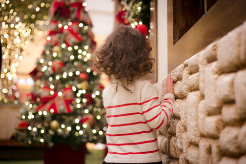 Girl looking at christmas tree