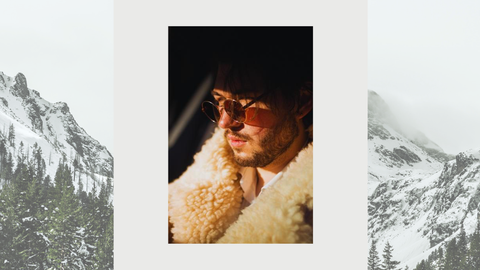 image of male model wearing joseph abboud sunglasses over an image of mountains 