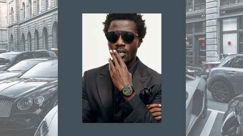 image of male model wearing joseph abboud sunglasses over an image of cars