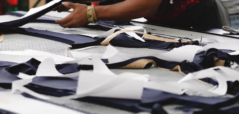 pieces of suit fabric on table 