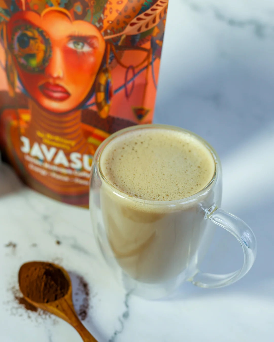 Cup of moksha on a wooden background with spoon