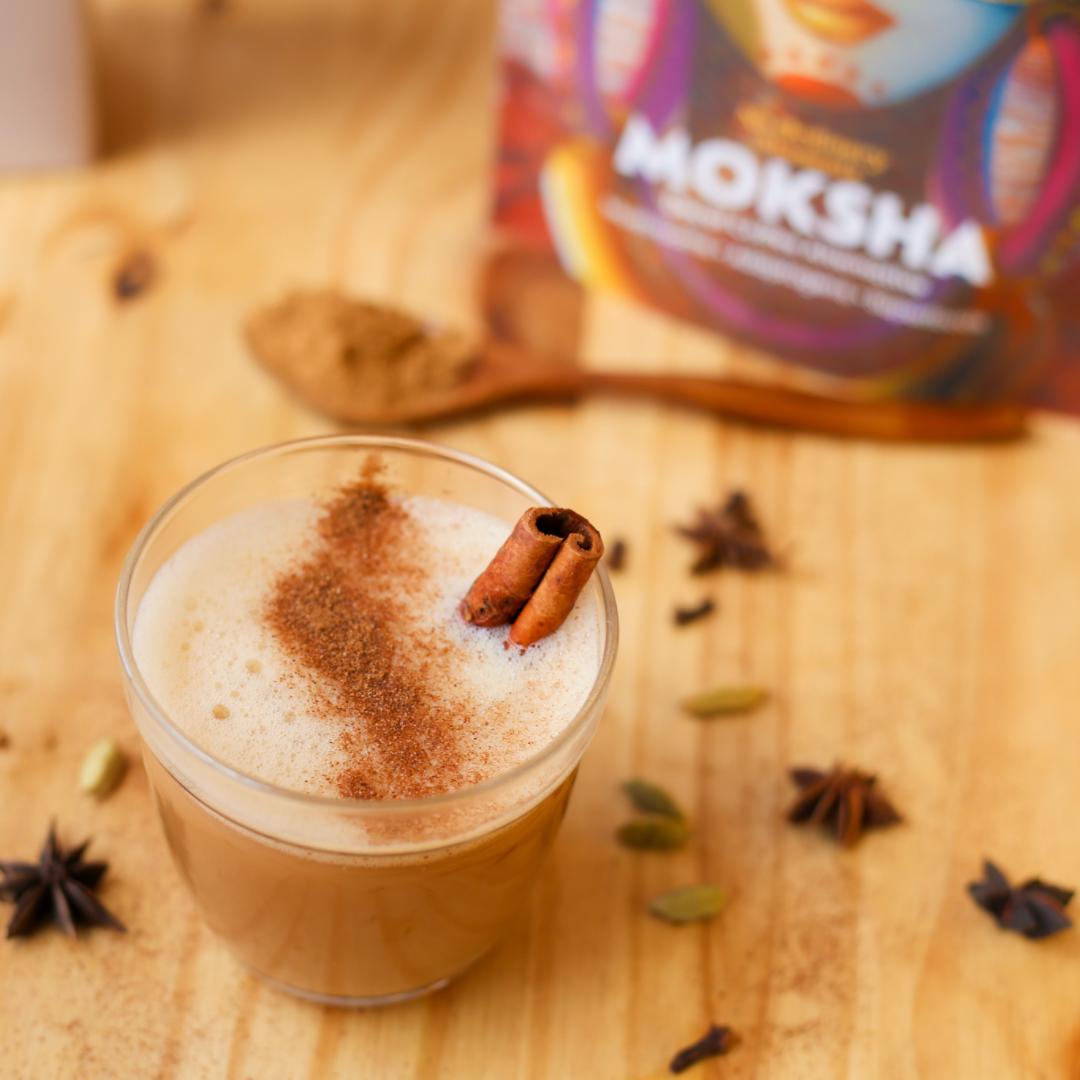 Cup of moksha on a wooden background with spoon