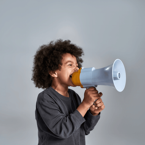 a kid yelling into a megaphone