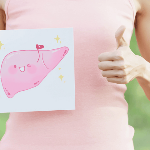 a woman holding a liver image with thumbs up