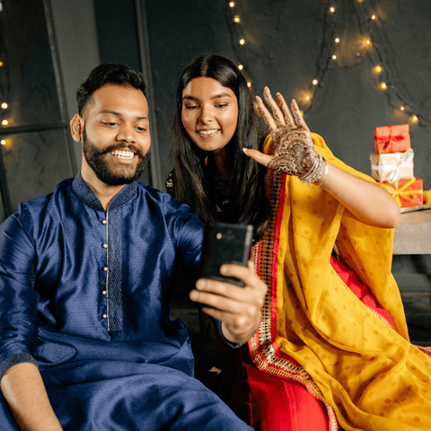 man and lady in indian outfit