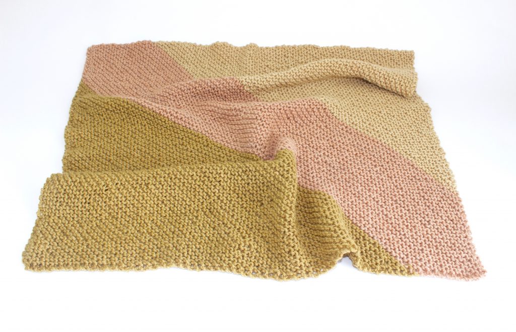 naturally dyed hand knitted baby blanket made by Juniper & Bliss