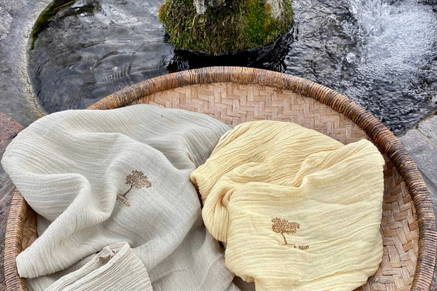 Juniper & Bliss naturally dyed organic cotton on a basket next to the spring at Oare Marshes, East Kent. 