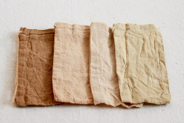 Organic cotton pouches dyed with alder cones