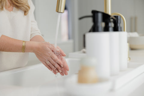 Nat at the sink washing her hands with Simple Suds Hand Soap