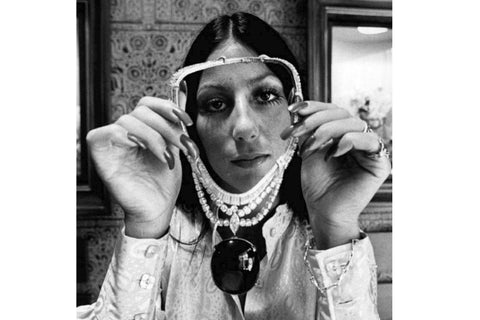 Cher holding the incredible Black Star of Queensland sapphire on a necklace in 1971 for the Sonny and Cher Comedy Hour.