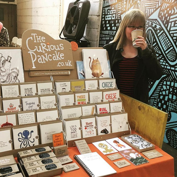 Claire standing next to her stall at a Crafty Fox Market in London.