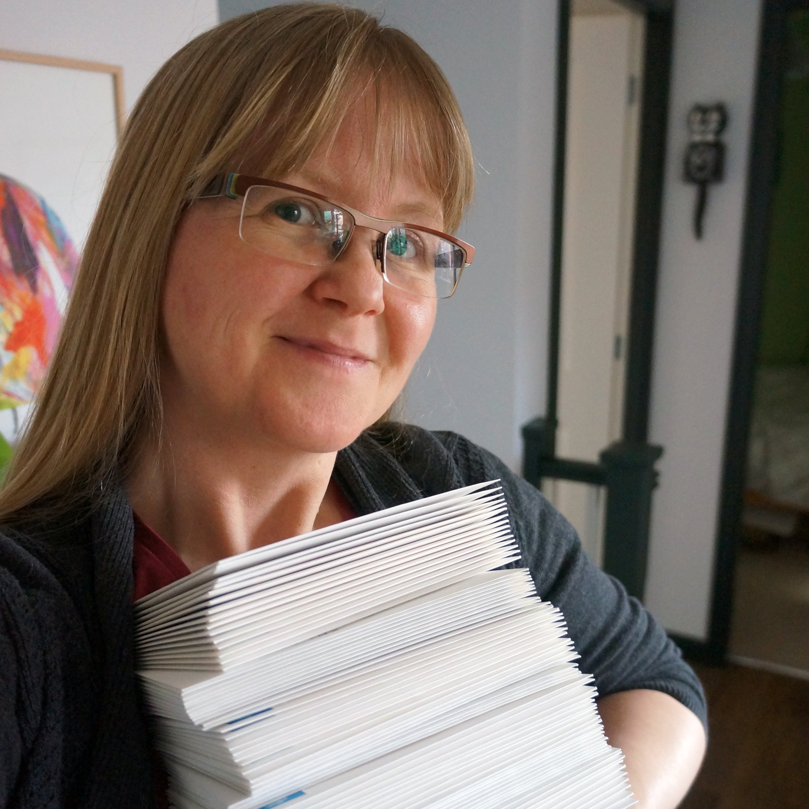 Claire, founder of The Curious Pancake, with a healthy stack of handwritten cards ready to be posted!