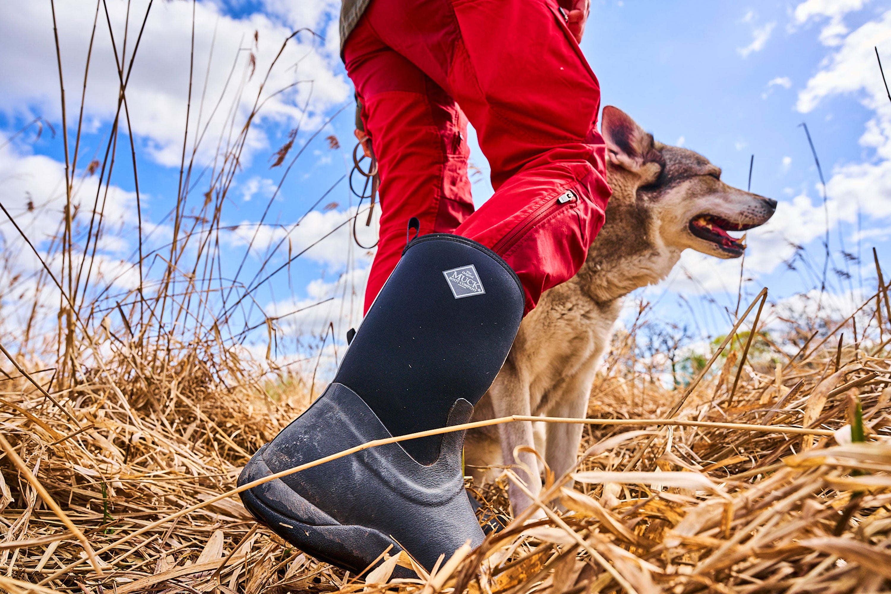 Nathalie out with one of her dogs, wearing a pair of Muck Boots