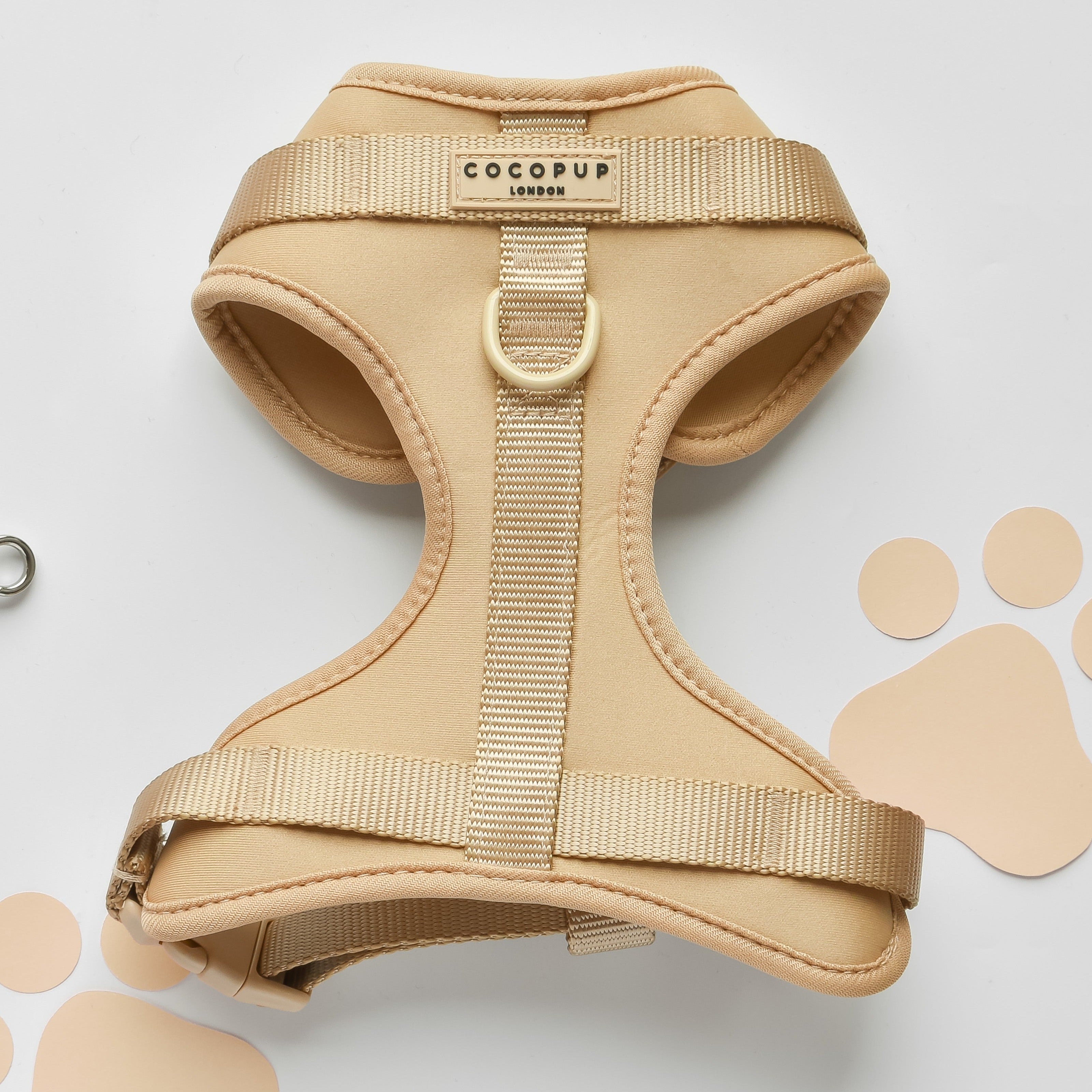 Beige dog harness with brand logo 'COCOPUP LONDON' on a white background.